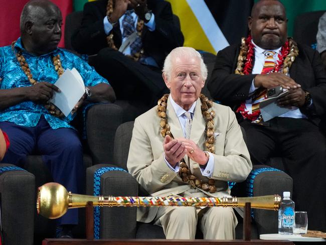 Britain's King Charles III (C) reacts during the opening ceremony for the Commonwealth Heads of Government Meeting (CHOGM) in Apia, Samoa, on October 25, 2024. (Photo by Rick Rycroft / POOL / AFP)