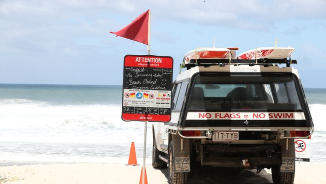 Tourists and locals watch on as giant surf pounds Gold Coasts northern beaches. Picture Glenn Hampson