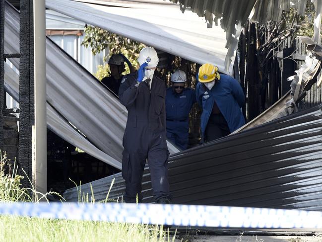 Police and fire crews at the scene of the fatal fire on Sunday. Picture: Andrew Henshaw