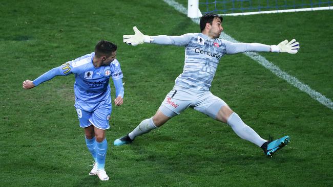 Jamie Maclaren leaves Daniel Lopar sprawling. Photo: George Salpigtidis/Getty Images