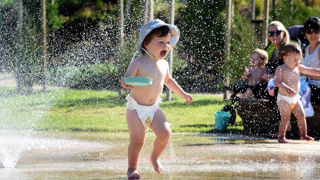 Toddlers enjoy some water play at the new Royal Park Nature Play playground. Picture: Nicole Garmston