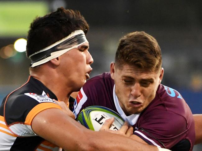 CANBERRA, AUSTRALIA - JANUARY 31: James O'Connor of the Reds is tackled during the round one Super Rugby match between the Brumbies and the Reds at GIO Stadium on January 31, 2020 in Canberra, Australia. (Photo by Tracey Nearmy/Getty Images)