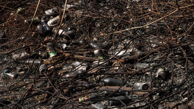 Hundreds of bottles exposed following the hazard reduction burns. Picture: (AAP Image / Julian Andrews).