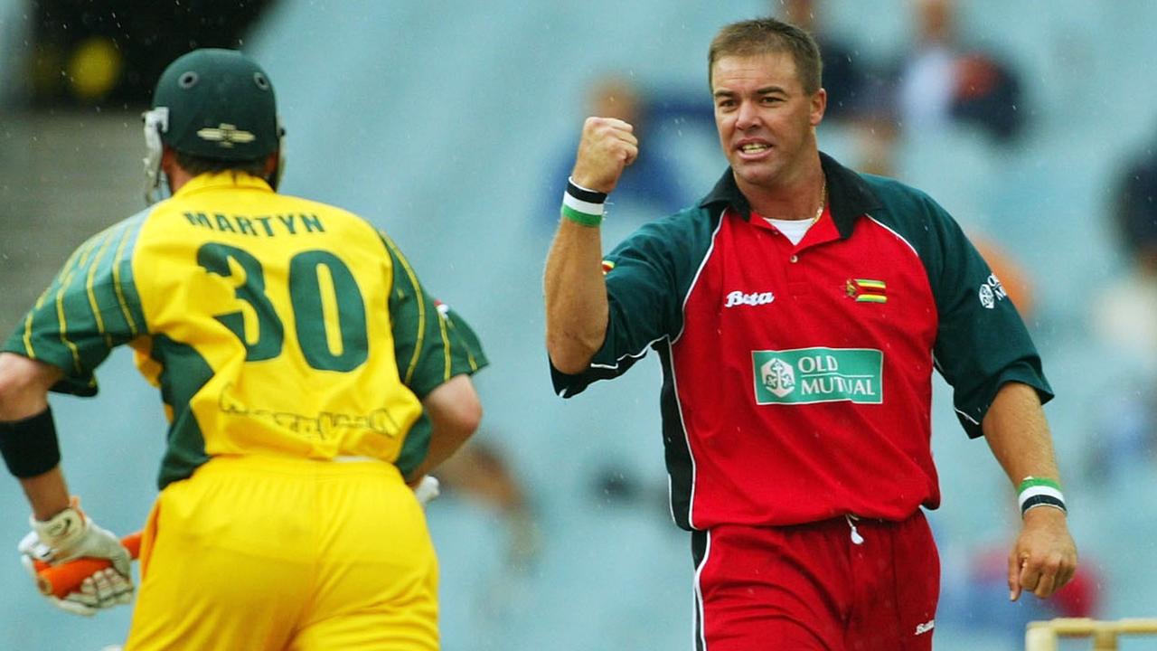 Heath Streak of Zimbabwe celebrates the wicket of Damien Martyn.