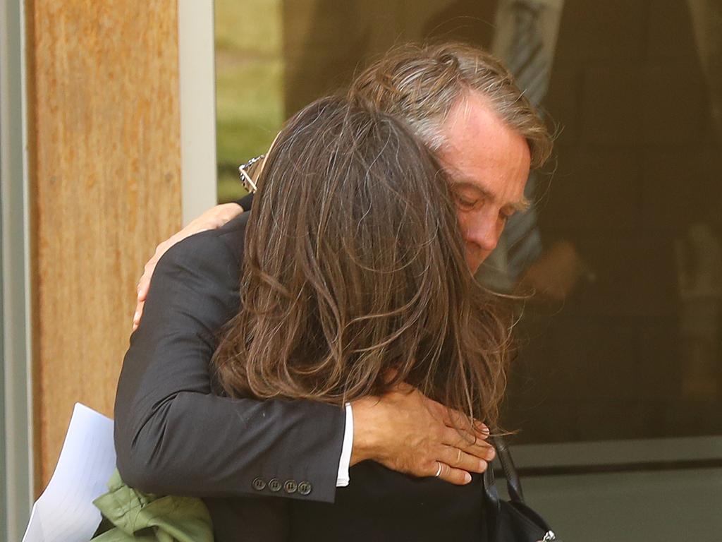 Andrew and Jillyanne Redpath embrace after the funeral service. Picture: Alison Wynd