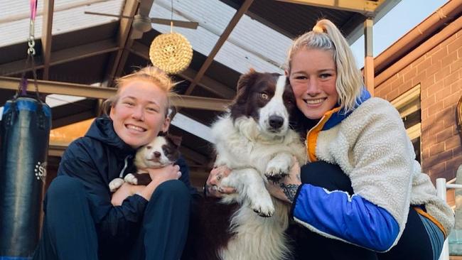 AFLW players Kodi Jacques and Tayla Harris and their dogs Elaine and Beans. Kick Like Tayla streams on Prime Video from May 27. Picture: Instagram