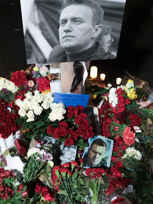 People leave flowers and candles for the late Russian opposition leader Alexei Navalny. Picture: AFP
