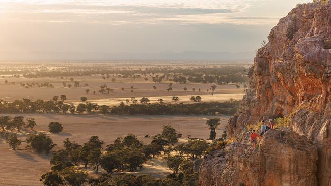 Melissa Edwards, Ben Shepherd and Madi Russell after climbing Muldoon. Picture: The Australian / Nadir Kinani