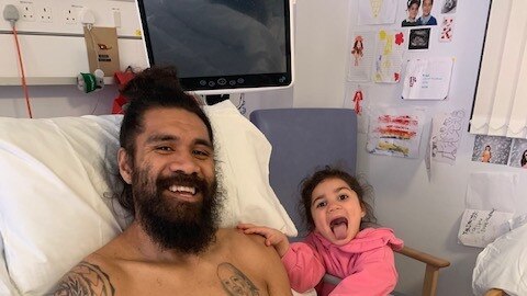 Mose Masoe in hospital with daughter Marlow