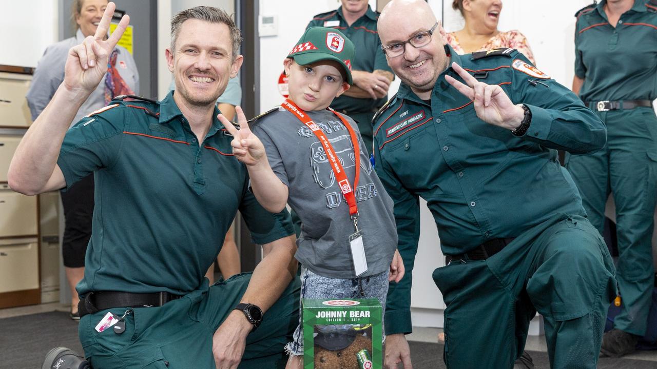 Intensive care paramedics Dan Robertson and Toby Bugter reunite with Darwin boy Harrison Grey after both performing lifesaving treatment in December last year. Picture: Floss Adams