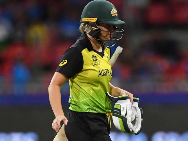 Australia’s Alyssa Healy walks from the pitch after being caught and bowled by India’s Poonam Yadav for 51. Picture: AAP image/Dean Lewins