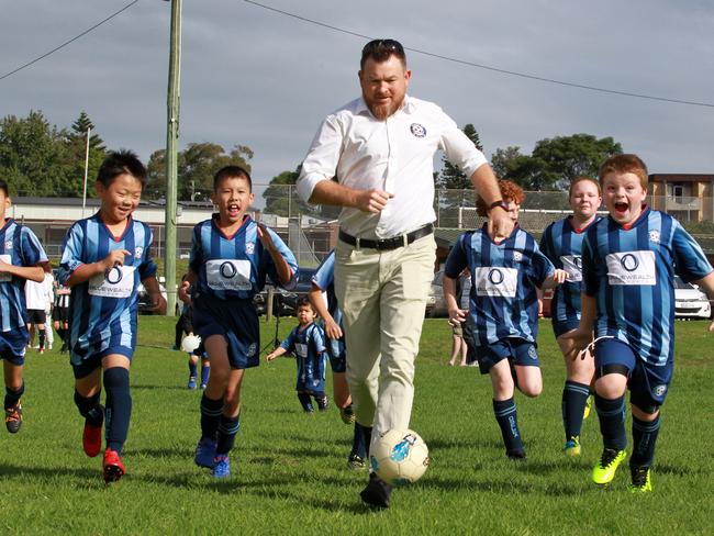 Roselea Football Club vice president Rohan Primrose with young players. Picture: Mark Scott