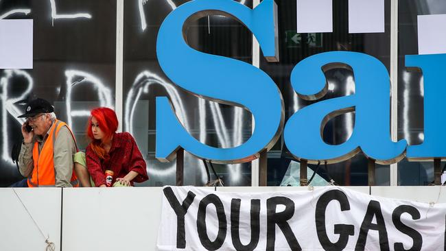 Ian Fox and Ngoc Nguyen on the Santos building roof during their protest in March. Picture Matt Turner.