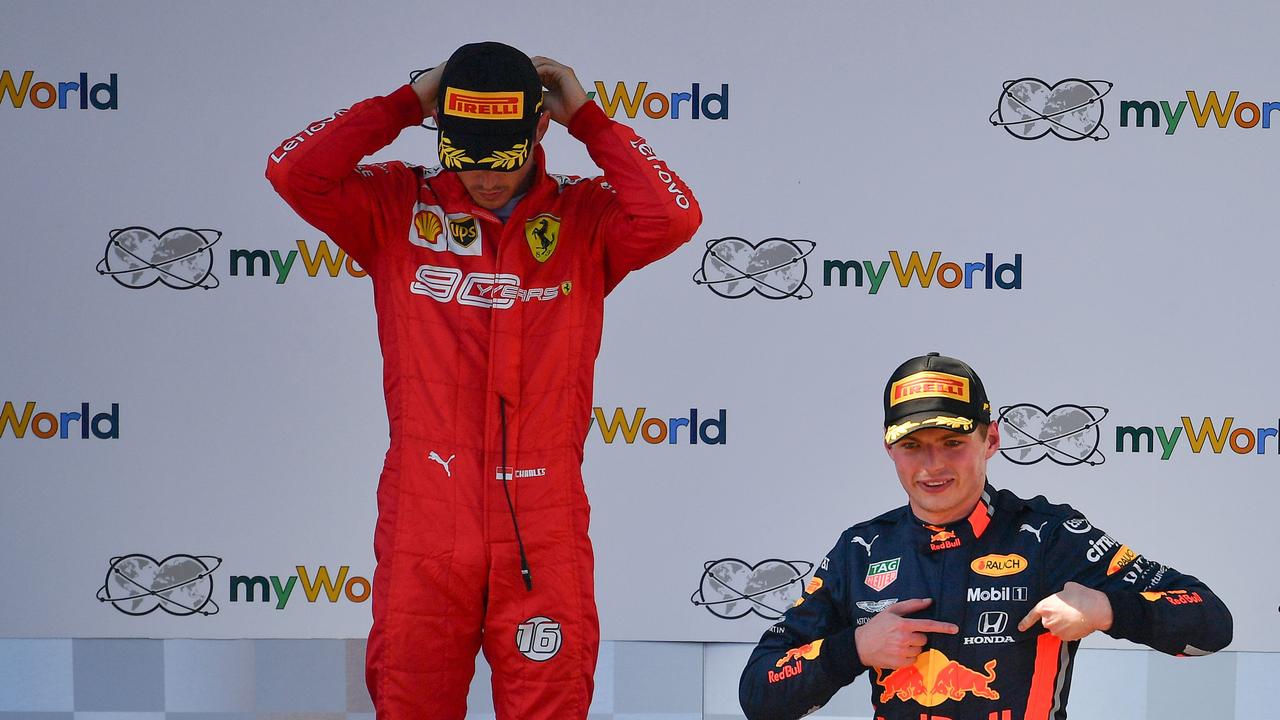Charles Leclerc barely contains his frustration as Max Verstappen celebrates his Austrian GP win.