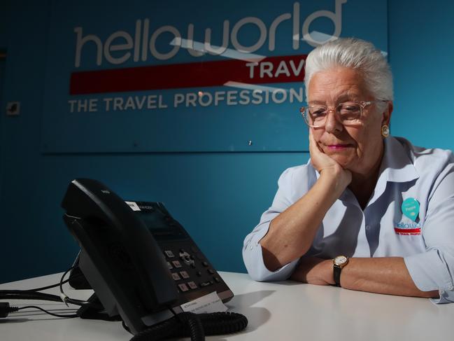 Manager Andrea Cole waits for phone inquiries at the Helloworld Mudgeeraba office. The travel agent is disheartened as the industry struggles on with  less than a third of travel agents operating on the Gold Coast compared to pre-Covid levels. Picture Glenn Hampson