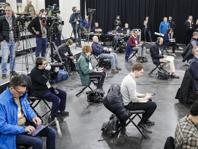 Journalists practise social distancing during a news conference in New York. Picture: AP Photo/John Minchillo