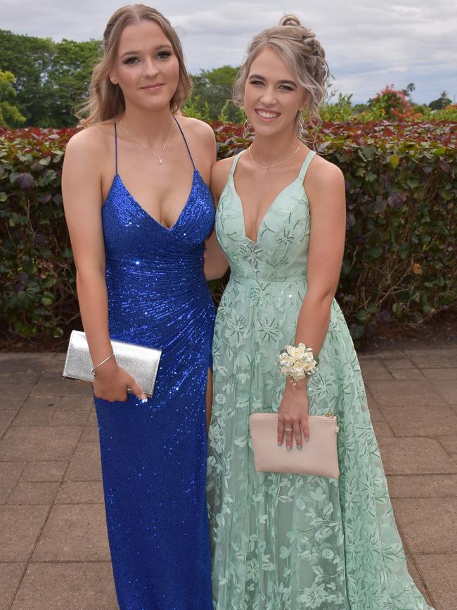 Ella Humphries and Karissa Giumelli posing for photos at Mackay Botanic Gardens before their Mackay State High School 2021 Year 12 formal, November 16, 2021. Photo: Tara Miko and Janessa Ekert