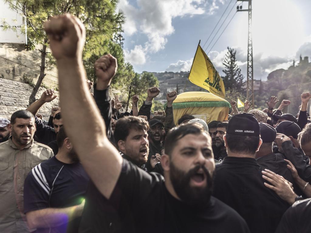 Hezbollah supporters carry the coffin of a militant in Kherbet Selem. Picture: Manu Brabo/Getty Images