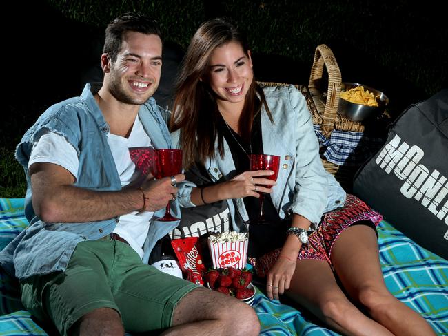 Romance by the light of the silvery moon — and screen. Picture: Chris Pavlich