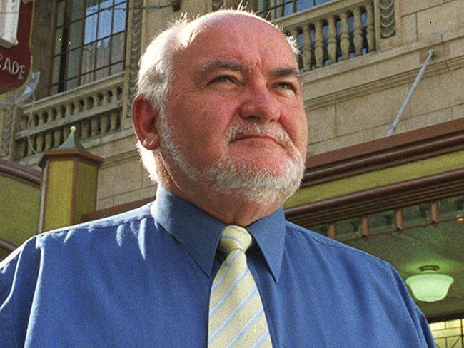 Former Hoyts state manager John Cronin outside the Regent Cinema in Regent Arcade, Adelaide that is closing 19 Jan 2004. closure/Cinemas