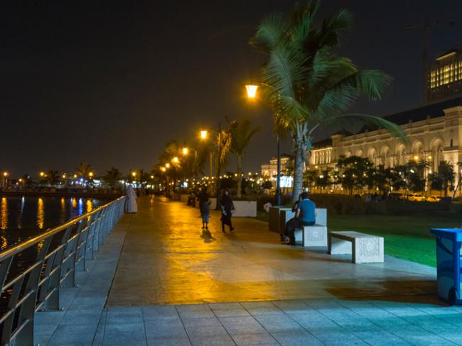 View of night-life with people hanging out and walking along the Jeddah's Corniche, a coastal resort area of the city of Jeddah in Saudi Arabia.