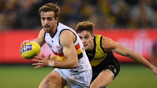 Jordan Gallucci tries to evade Richmond’s Jayden Short. Picture: AAP Image/Julian Smith