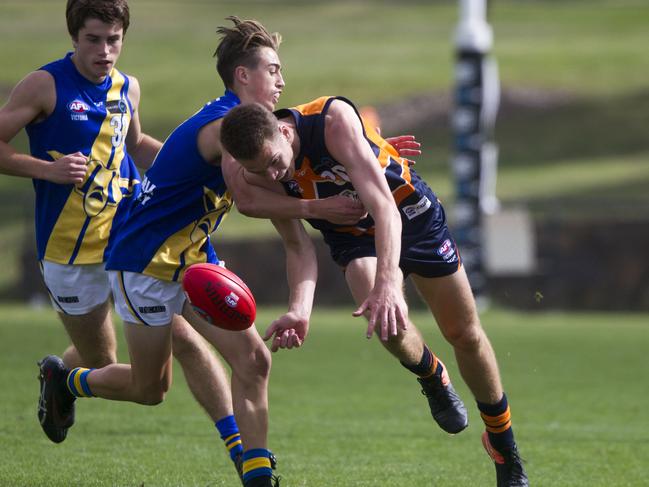 Mitch Podhajski battles for possession in the TAC Cup against Western Jets. Picture: Richard Serong