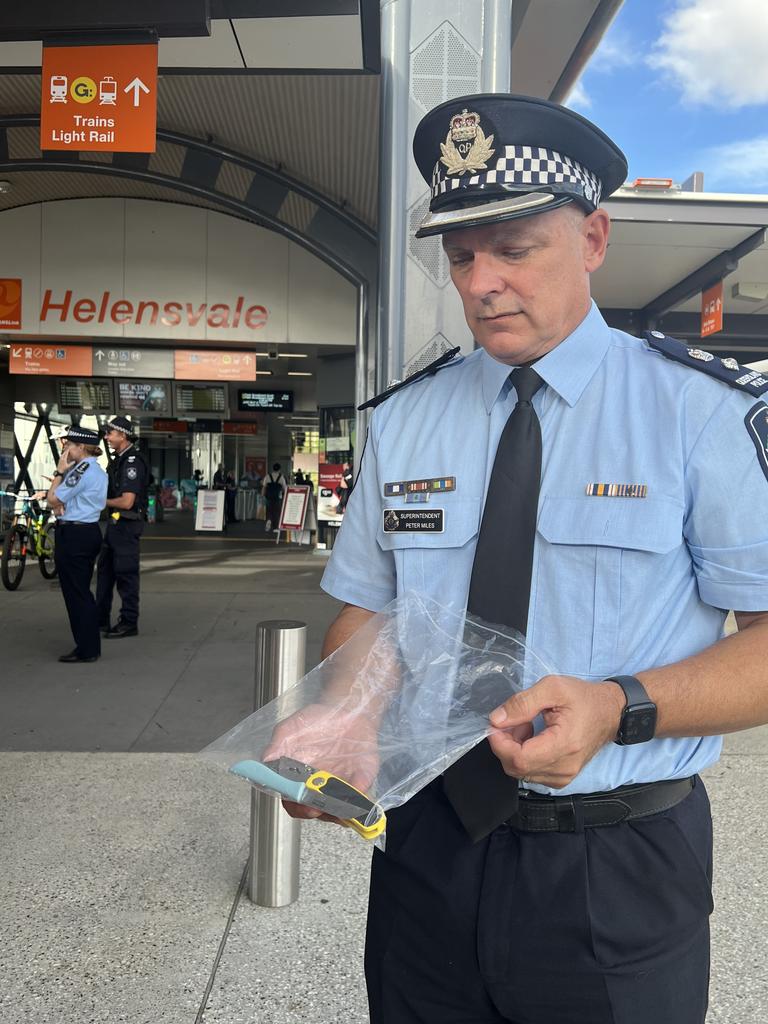 Superintendent Peter Miles with knives seized by police at Helensvale Station.