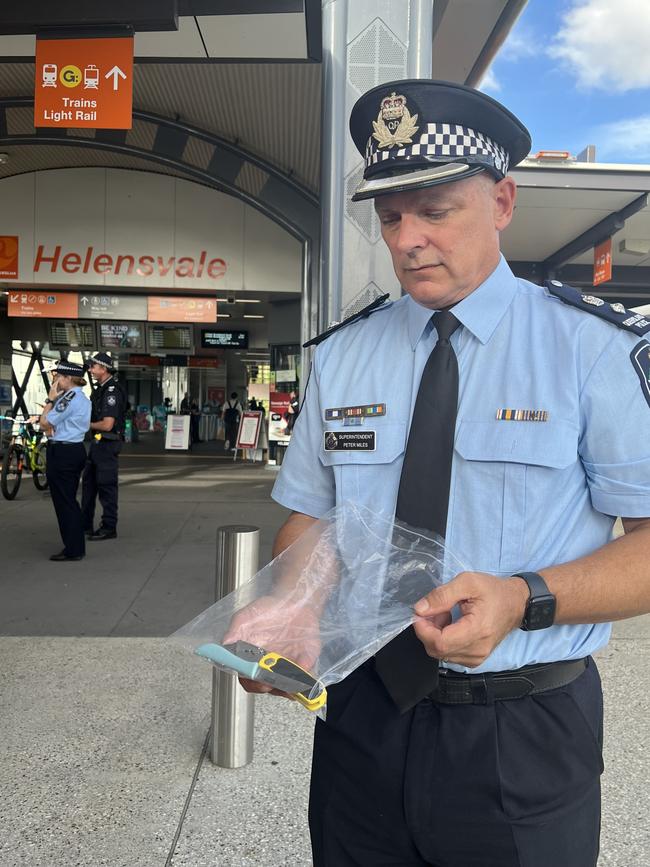 Superintendent Peter Miles with knives seized by police at Helensvale Station.