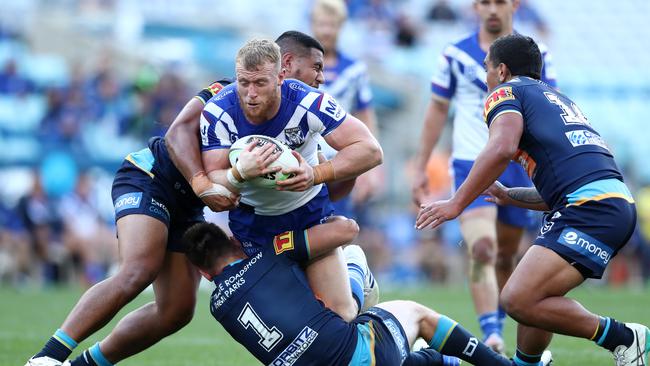 Luke Thompson of the Bulldogs is tackled during the round 17 NRL match between the Canterbury Bulldogs and the Gold Coast Titans at ANZ Stadium on September 05, 2020 in Sydney, Australia. Photo: Matt King/Getty Images.