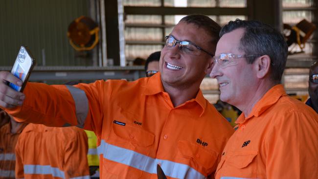 Premier Mark McGowan (R) at BHP South Flank iron ore mine, holding a  'punishment stick'. Picture by: Rebecca Le May