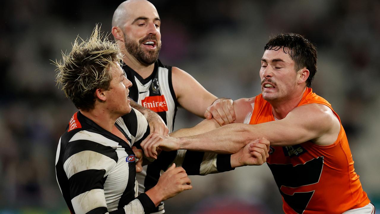 Jack Ginnivan clashes with GWS midfielder Lachie Ash.