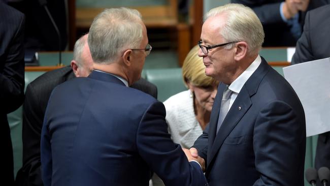 Andrew Robb is congratulated by then PM Malcolm Turnbull after announcing his retirement from politics in 2016.