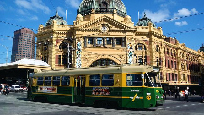 A tram trundles past Flinders St in 1997.