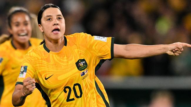 Australia's forward #20 Sam Kerr celebrates scoring her team's first goal during the Australia and New Zealand 2023 Women's World Cup semi-final football match between Australia and England at Stadium Australia in Sydney on August 16, 2023. (Photo by Izhar KHAN / AFP)