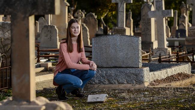 WW1 teen sleuth Lara Dawson at the unmarked grave of Pte Patrick Aloysius Byrne in West Terrace Cemetery. He died in 1922 and is related to former Prime Minister Sir John McEwen. Picture: Brenton Edwards