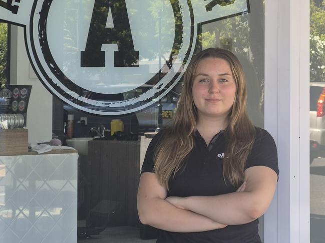 Cassidy Hudson, 22, considers it a chance of a lifetime to manage and operate her own barber shop. Image credit: Eden Regan