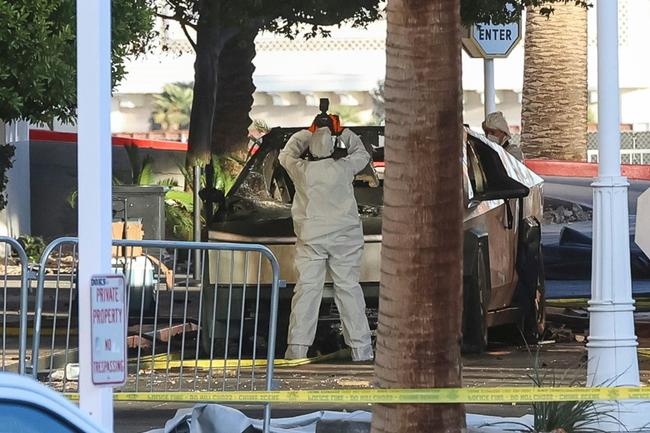 An investigator photographs the Tesla Cybertruck that exploded outside Trump International Hotel in Las Vegas