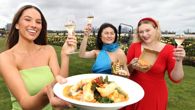 You don’t need to break the bank at this year’s Melbourne Cup Carnival, with The Park serving selection of affordable eats. Demi Brereton, Renata Liu, and Giselle Martin at Flemington. Picture: David Caird.