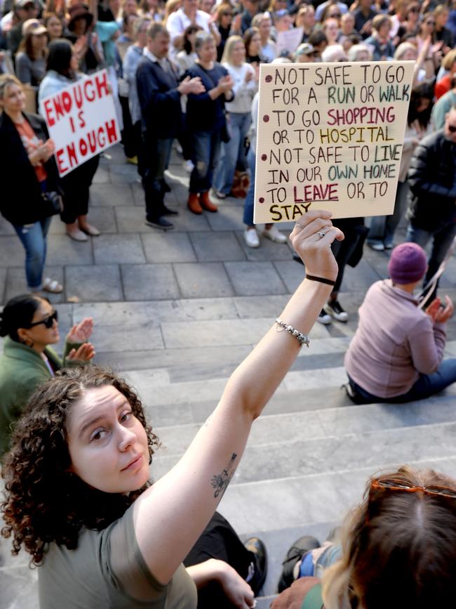 Rally attendee Emily on the steps of Parliament House. Picture Dean Martin