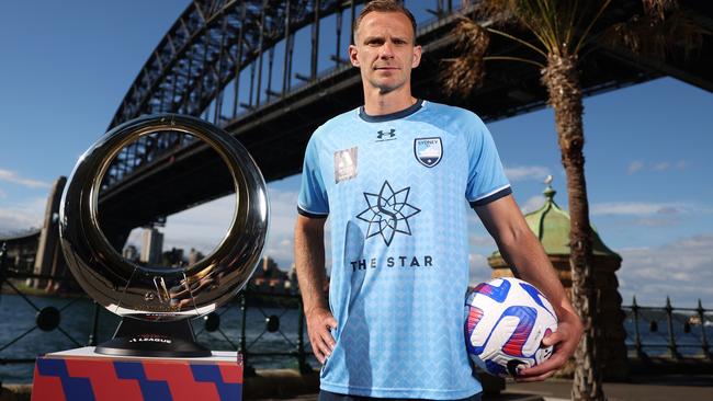 SYDNEY, AUSTRALIA - MAY 02:  Alex Wilkinson of Sydney FC poses with the A-League trophy during the A-League Mens 2023 Finals Series Launch at Pier One Sydney on May 02, 2023 in Sydney, Australia. (Photo by Mark Metcalfe/Getty Images)