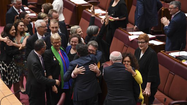 Same-sex marriage supporters celebrate after the bill passed the Senate yesterday. Picture: AAP