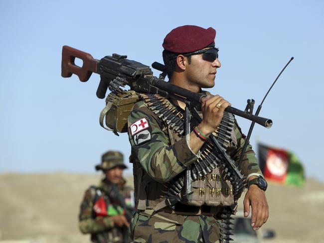 Afghan National Army soldiers stand guard at a checkpoint on the outskirts of Kabul, Afghanistan, Monday, Aug. 21, 2017. Deep in the mountains of eastern Afghanistan, on the front lines against Taliban and Islamic State fighters, U.S. military commanders say they needs more forces to better train Afghan soldiers to combat the escalating threat. Theyâ€™re hoping President Donald trump heeds their calls when he outlines his new war strategy Monday.  (AP Photo/Rahmat Gul)