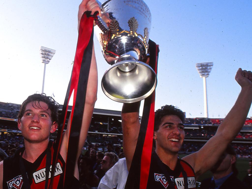 James Hird and Rick Olarenshaw of the Bombers celebrate winning the 1993 AFL Grand Final. Picture: Getty Images