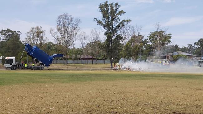 A garbage truck dumps a load of smouldering rubbish at Rupertswood Park, Mt Druitt, after it caught alight on November 25. Picture: Supplied