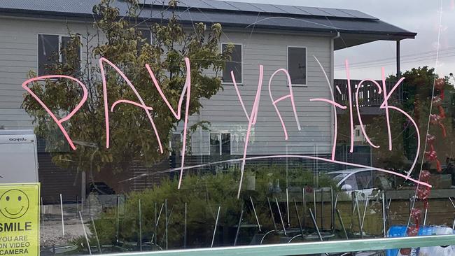 “Pay ya tick” was allegedly spray painted on the restaurant windows. Picture: Katrina Muhsin/10 NEWS FIRST