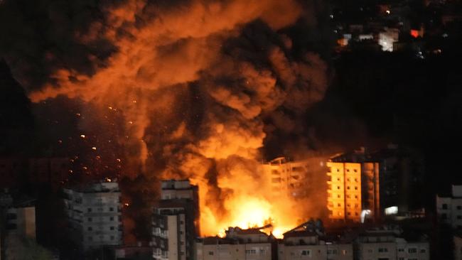 Flame and smoke rises from buildings hit by Israeli air strikes on Dahiyeh, in the southern suburb of Beirut. Picture: AP.