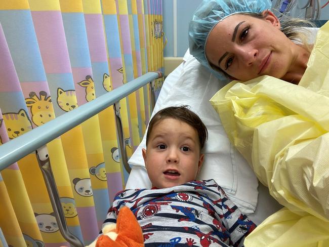 Little Xavier with mum Danielle in hospital follow his relapse with a rare childhood cancer. His family is desperate to get him to the US on a clinical trial to boost his chances of beating the disease. Picture: Facebook, Rare Cancers