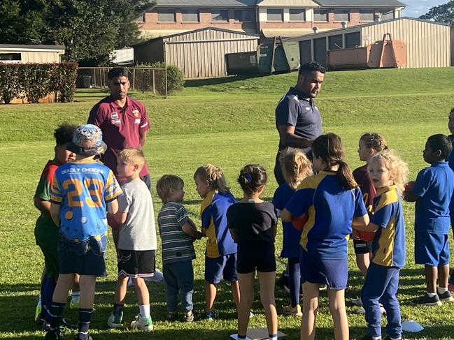 Keidean Coleman of the Brisbane Lions with kids at the Auskick Murri Carnival program in Toowoomba.