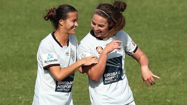 Carson Pickett celebrates her goal with Jenna McCormick during Roar’s win over the Wanderers. Picture: Getty Images